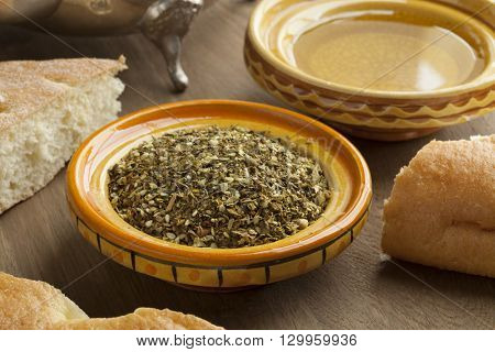  Bowl with ZaÃÂ¢??atar, olive oil and bread for breakfast