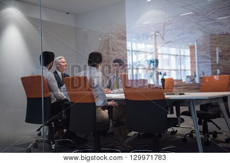 business people group brainstorming on meeting and businessman presenting ideas and projects oon laptop and tablet computer