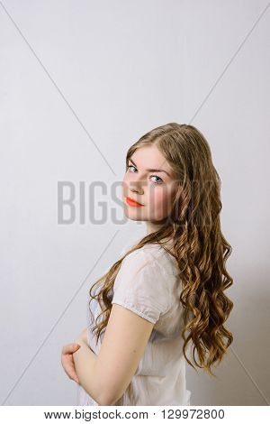 emotionless young woman posing on a white background