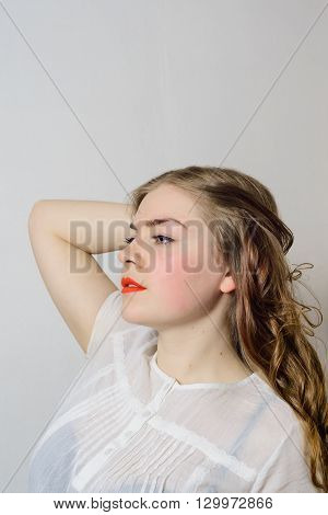 emotionless young woman posing on a white background
