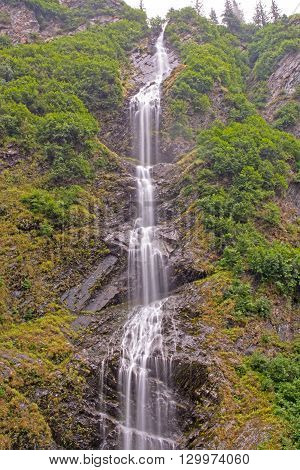 Dramatic Bridal Veil Falls in the Mist of Keystone Canyon near Valdez Alaska