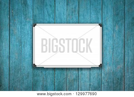 Blank white board on blue wooden texture background, stock photo