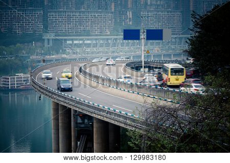 traffic on highway,with city skyline background,chongqing china.