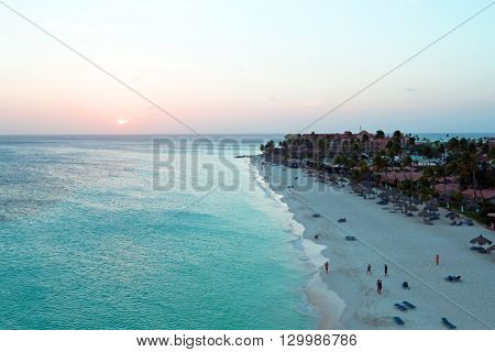 Aerial from a beautiful sunset at Manchebo beach on Aruba island in the Caribbean sea