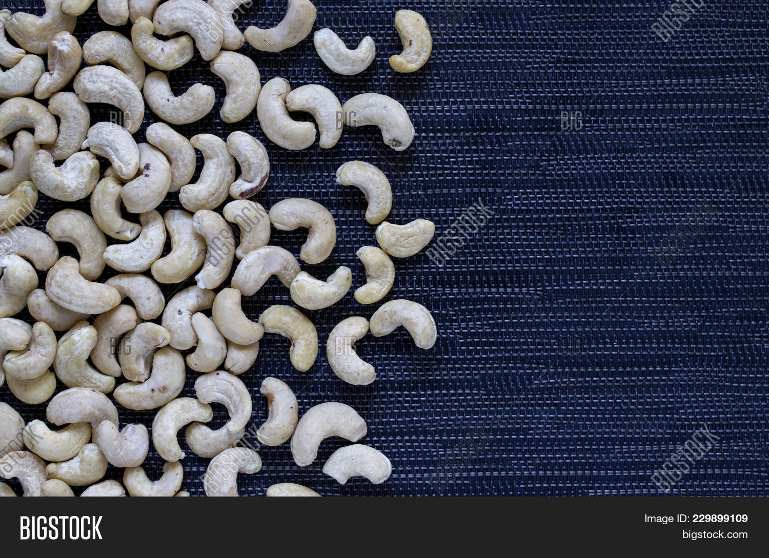 cashew heap on dark image photo free