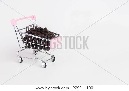 Coffee Beans In Stroller On White Background