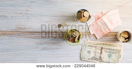 American Dollars And Ukrainian Hryvnia On A White Background Isolates.