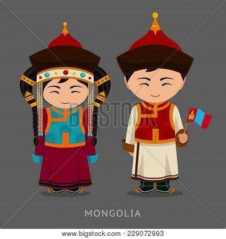 Mongols In National Dress With A Flag. Man And Woman In Traditional Costume. Travel To Mongolia. Peo