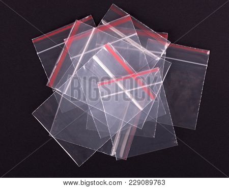 Plastic Transparent Zipper Bag On Black Background. Block Zip Lock Packaging. Empty Polythene Zip-lo