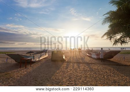 Ahungalla, Sri Lanka, Asia - Traditional Longboats At Ahungalla Beach During Sundown