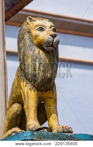 Madikeri, India - October 31, 2013: Shree Omkareshwara Temple. Closeup Of Statue Of Sitting Male Lio