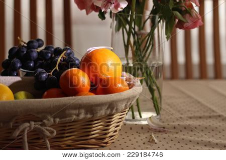 Oranges Grape And Lime On The Table With Flower