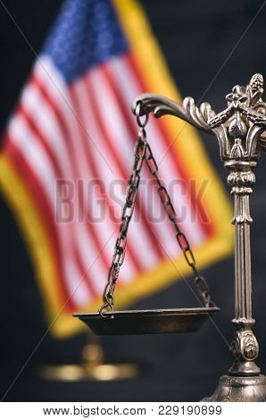 Law And Justice, Legality Concept, Scales Of Justice In Front Of The American Flag In The Background
