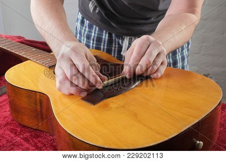 Musical Instrument Guitar Repair And Service - Grinding Bridge Nut.