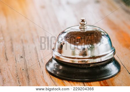 Service Bell - Vintage Filter On Wood Background.