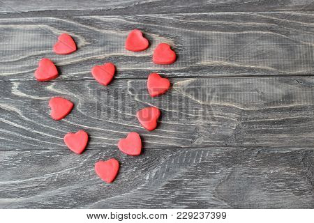 Valentine's Day . Red Hearts On A Wooden Background.
