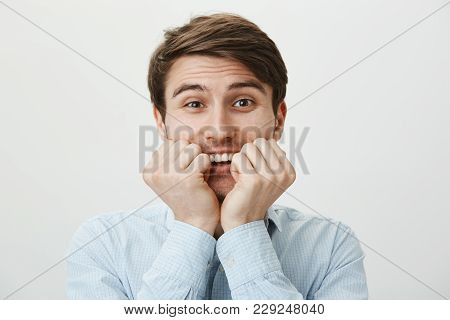 Guy Is Very Thrilled To Meet Famous Person. Portrait Of Lovely Attractive European Man Holding Clenc