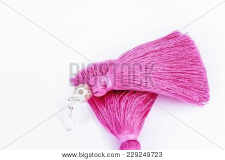 Pink Handmade Earrings On A White Background.