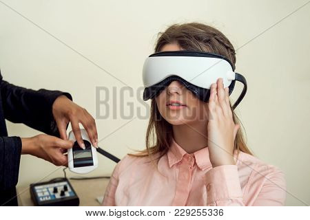 Girl Is Worried For Her Sight. Relaxed Modern European Woman Sitting In Office Of Eye Care Specialis