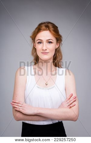 Portrait Vertical Up To The Waist Young, Beautiful Business Woman, Student With Lred, Curly Hair And