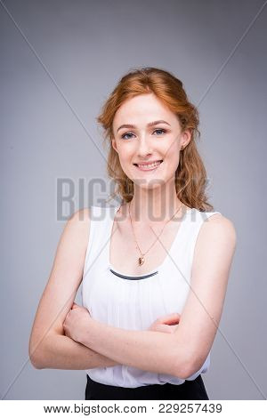 Portrait Vertical Up To The Waist Young, Beautiful Business Woman, Student With Lred, Curly Hair And