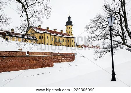 Belarusian Attraction Nesvizh Castle Covered With Snow In The Winter Season.