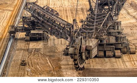 Huge Bucket Wheel Excavator Mining For Brown Coal In An Open Pit Mine.