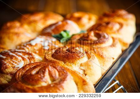 Sweet Buns With Jam And Cream On A Baking Sheet