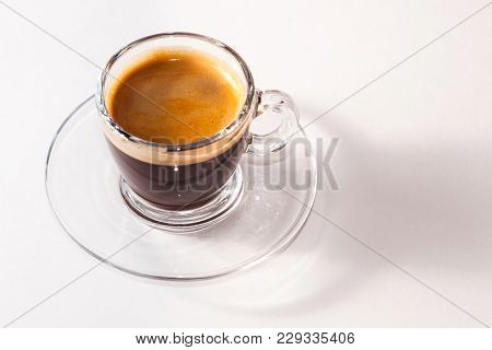 Coffee Americano In A Transparent Cup And Saucer On A White Background
