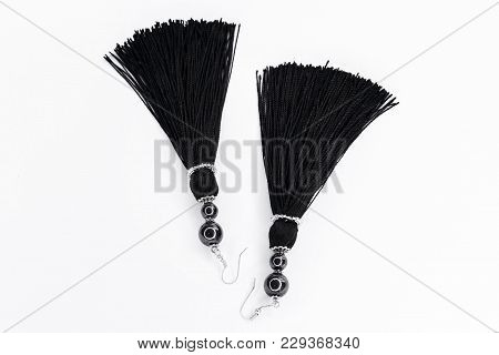 Black Handmade Earrings-brushes On A White Background.
