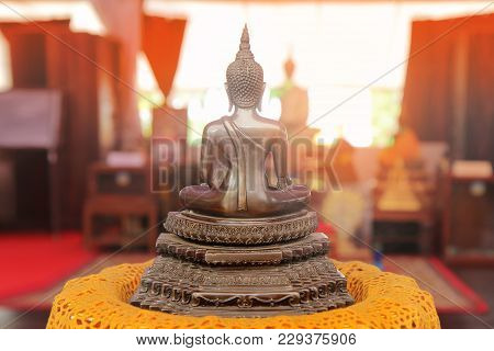 Buddha Meditating On A Lotus Base 5 Step.  Photographed From Behind