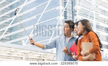 Teen Asia People Use Smart Phone To Selfie, Self-portrait Photography Shoot, Held In The Hand And Su