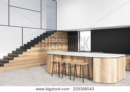 Functional White, Black And Wooden Kitchen Interior With A Concrete Floor And A Bar Stand With Stool