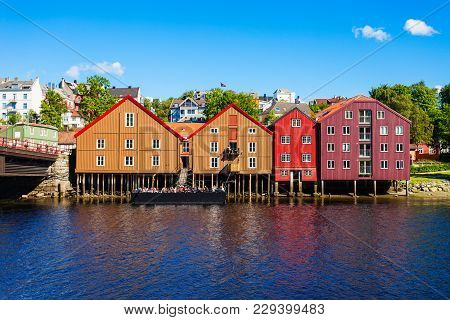 Colorful Old Houses At The Nidelva River Embankment In The Center Of Trondheim Old Town, Norway