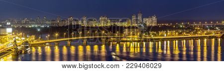 Kyiv (kiev) City, The Capital Of Ukraine At Night Beside The Dnipro (dniepr) River With Reflection I
