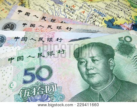 Yuan Banknotes On The Map Of China. Chinese Economy
