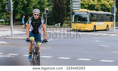 Viborg, Denmark -  August 14, 2016: An Unidentified Man Cycling In Viborg, Denmark.