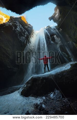 Staring At Gljúfrabúi Waterfall In Winter In Iceland