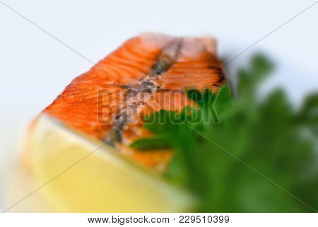 Grilled Salmon Steak With Greens And Lemon