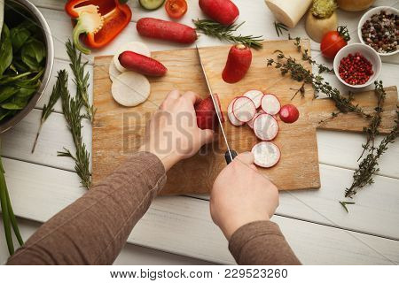 Woman Cutting Fresh Radish On Wooden Board. Natural Eating, Preparing Healthy Dietic Vegetable Salad
