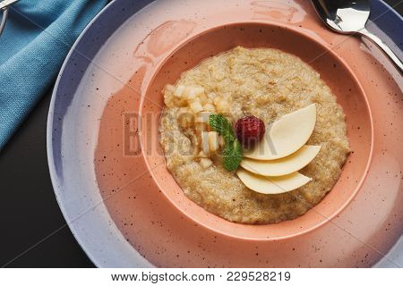 Delicious Restaurant Breakfast Background. Oatmeals Porrige With Fresh Berries And Pear On Pink Plat