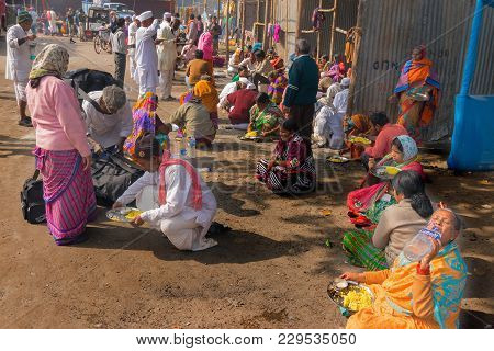 Kolkata, West Bengal , India - January 18th 2015 : A Seated Indian Male Selling Colorful Chappals (s