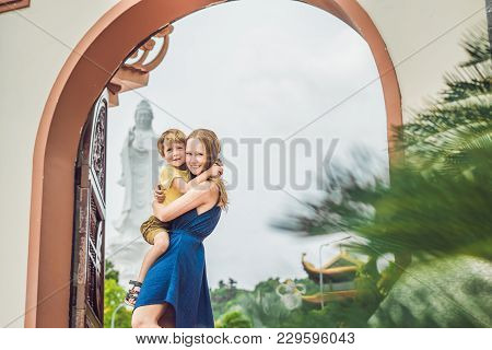 Happy Tourists Mom And Son In Pagoda. Travel To Asia Concept. Traveling With A Baby Concept.
