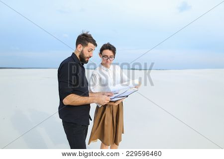 Landscape Designer Woman Come To Customer S New House To Show Sketches, People Standing Outdoors Dis