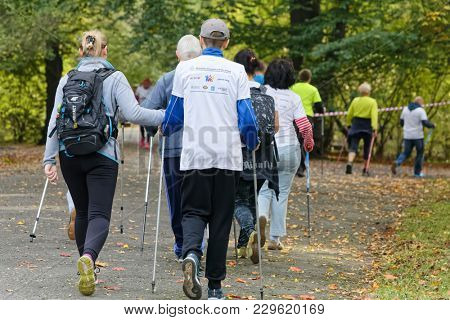 WROCLAW, POLAND - OCTOBER 15, 2017: People in fitness course nordic walking competition in the city park