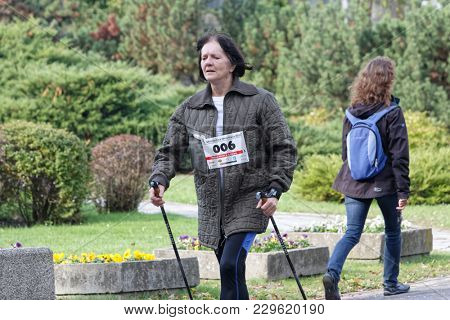 WROCLAW, POLAND - OCTOBER 15, 2017: People in fitness course nordic walking competition in the city park