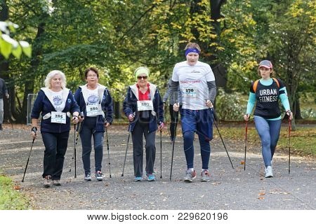 WROCLAW, POLAND - OCTOBER 15, 2017: People in fitness course nordic walking competition in the city park