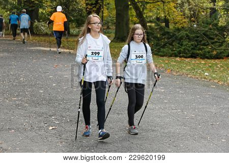 WROCLAW, POLAND - OCTOBER 15, 2017: People in fitness course nordic walking competition in the city park