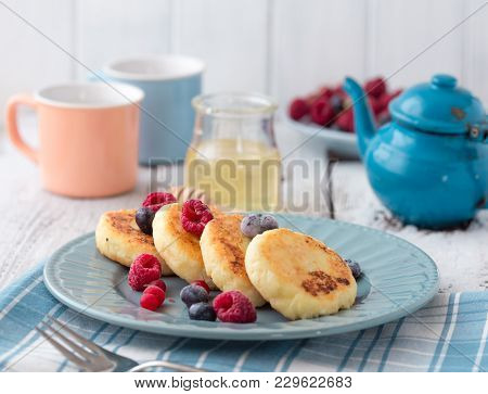 Cheesecakes. Beautiful Pancakes Made Of Cheese In A Black Frying Pan. Cheesecakes. Pancakes Curd. Pa