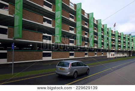Bracknell, England - March 04, 2018: A Car Passes By One Of The Multistory Car Parks In Bracknell, E